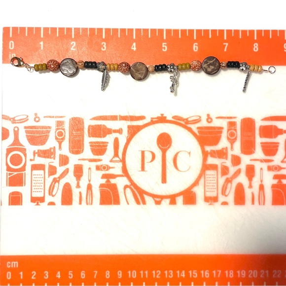 Hand Crafted Beaded Bracelet with Cross and Feather Charms - Picture 2 of 2